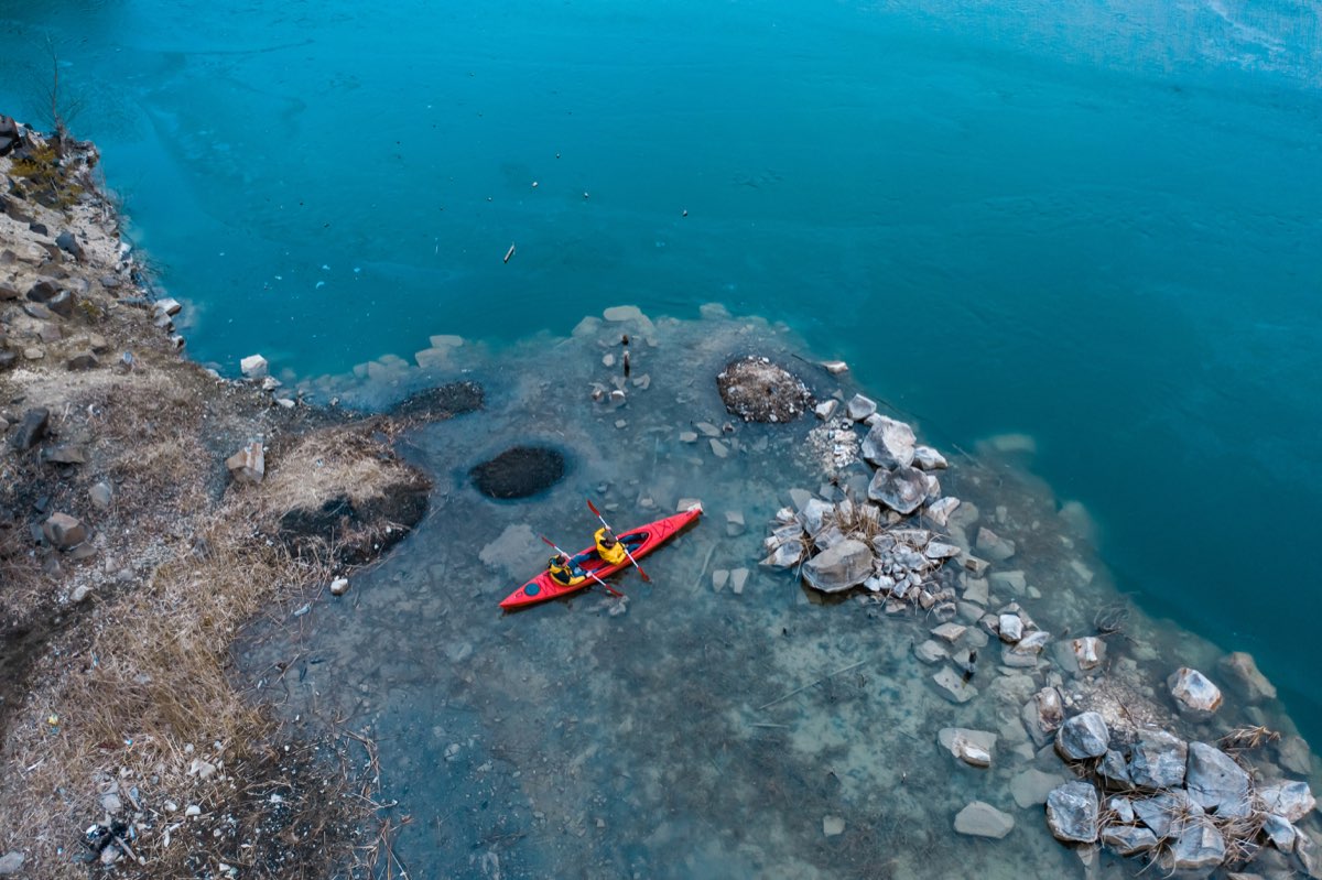 Kayakers exploring sea caves along the coastline